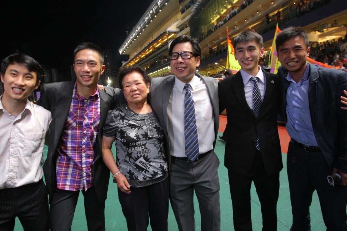 Dennis Yip is joined by his team after a dramatic night's racing.