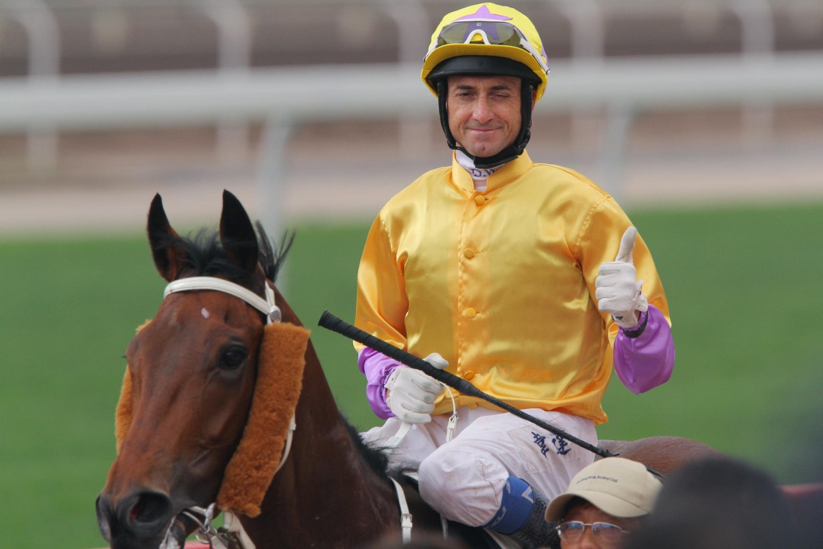 Douglas Whyte winks to the crowd after steering Peniaphobia to success.