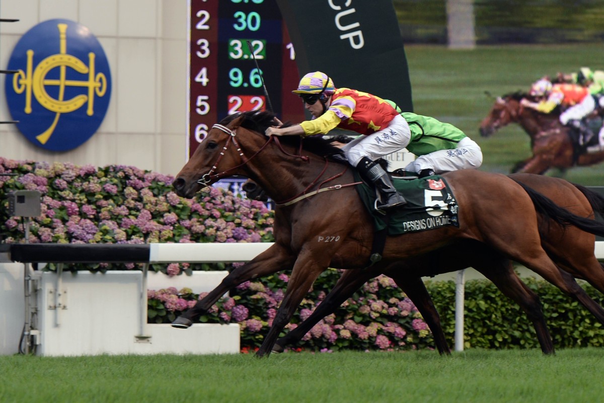 Tommy Berry finds the line aboard Designs On Rome as they outduel Military Attack. Photo: AFP