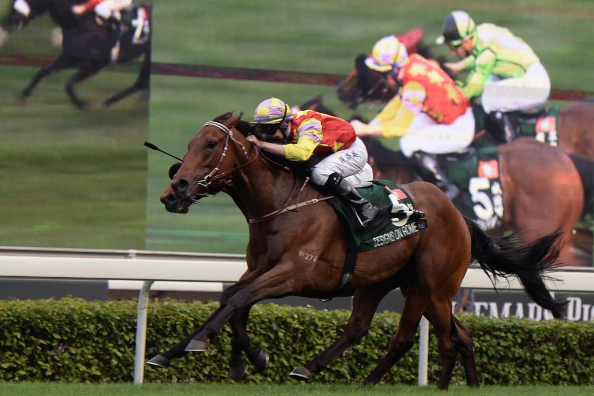 Tommy Berry aboard Designs On Rome approaches the finish line ahead of Joao Moreira on Military Attack in the QE II Cup. Photo: AFP