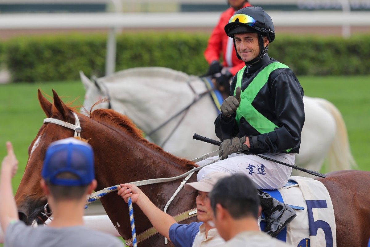 Douglas Whyte winks to a crowd member after winning at Sha Tin on Sunday with Key Witness. Photo: Kenneth Chan