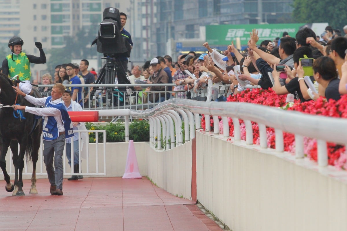 Anton Marcus brings Variety Club back to winner's circle to the cheers of the crowd.