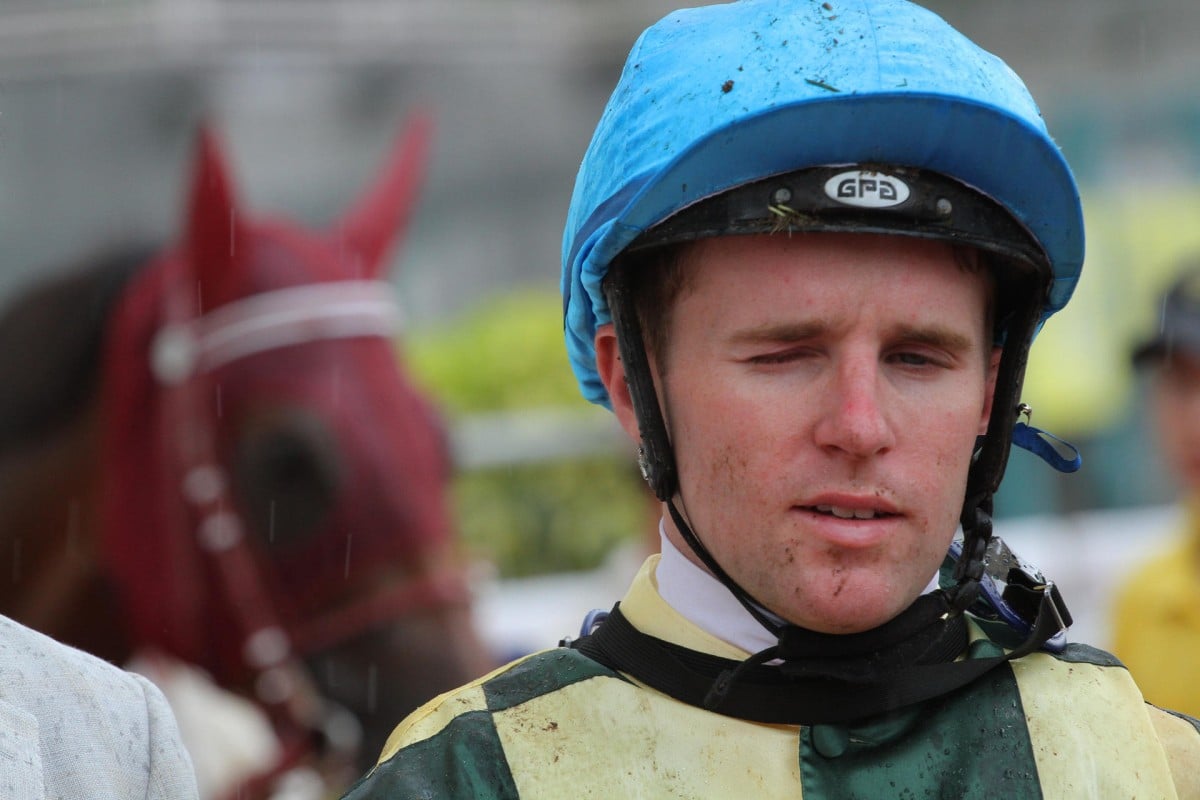 Tommy Berry's vision was severely hampered, but he still managed to steer Rewarding Hero to victory. Photo: Kenneth Chan