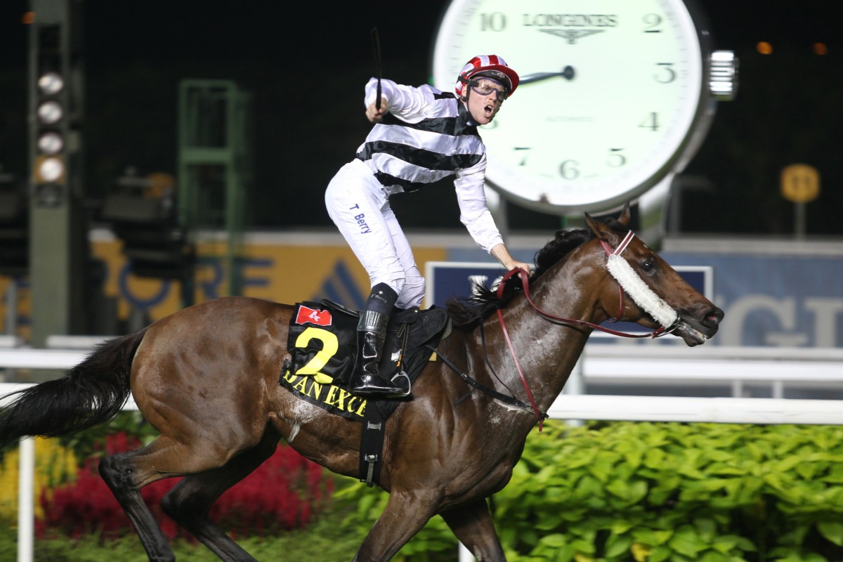 A pumped-up Tommy Berry crosses the line aboard Dan Excel to win the Singapore Airlines International Cup in Singapore. Photo: Kenneth Chan