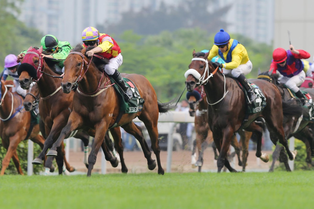Designs On Rome (Tommy Berry) races up to Military Attack (Joao Moreira) in the Audemars Piguet QE II Cup, with Vercingetorix (Anthony Delpech) in third. Photo: Kenneth Chan