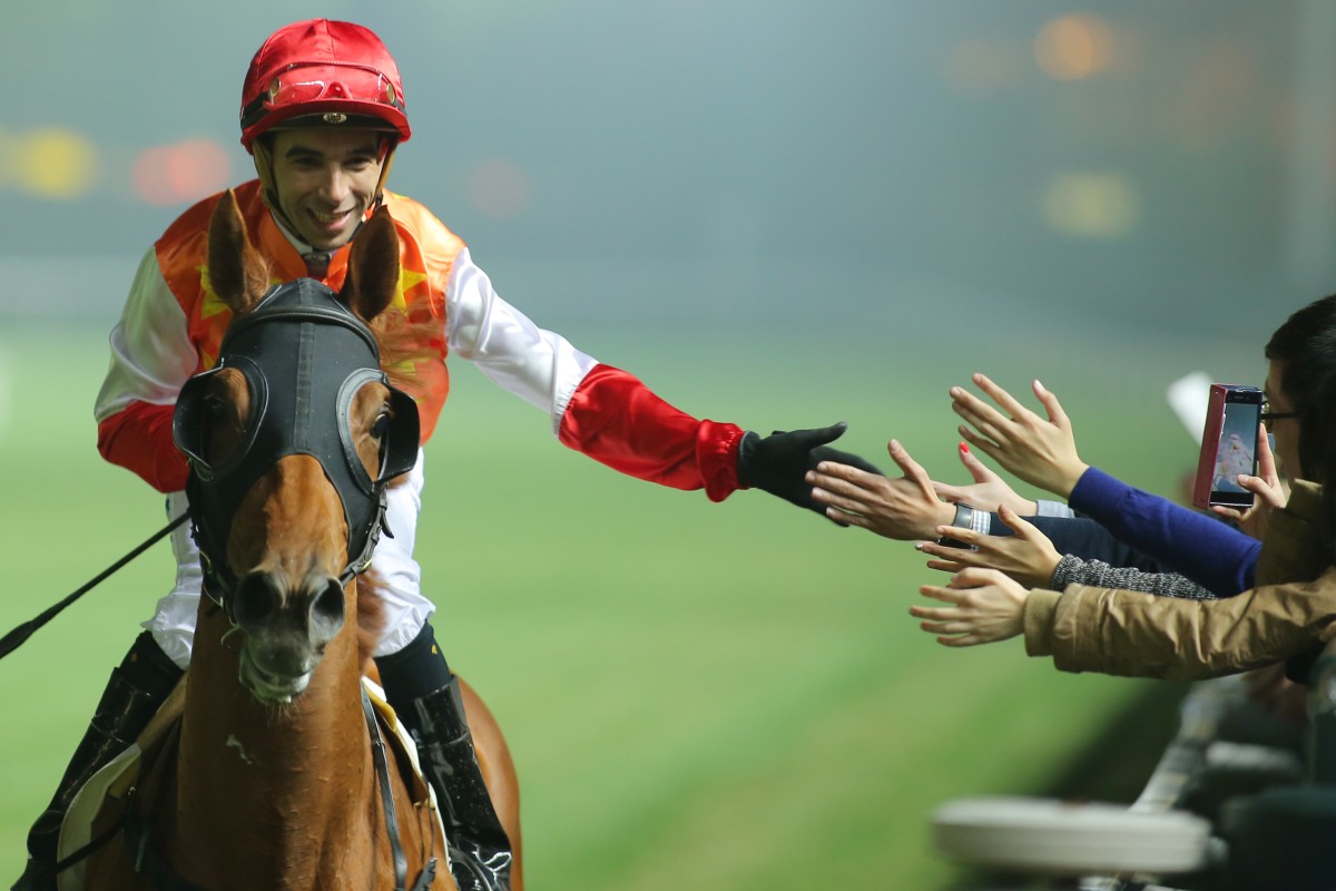 Joao Moreira acknowledges his fans as he comes back to scale aboard Star Majestic, after winning the Rotary Centenary Challenge Cup. 
