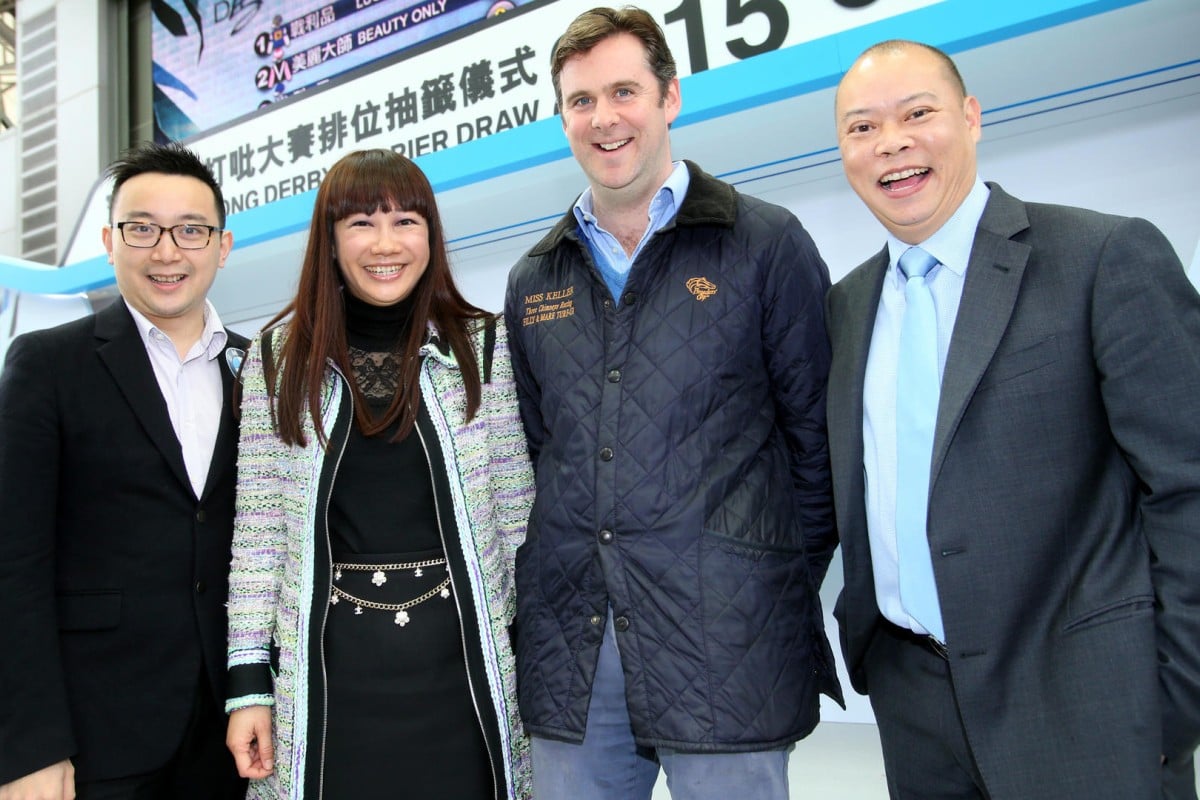 Redkirk Warrior's owner Jenny Tam poses with bloodstock agent Alastair Donald and trainer Chris So (right) at the barrier draw for the BMW Hong Kong Derby. Photos: Kenneth Chan