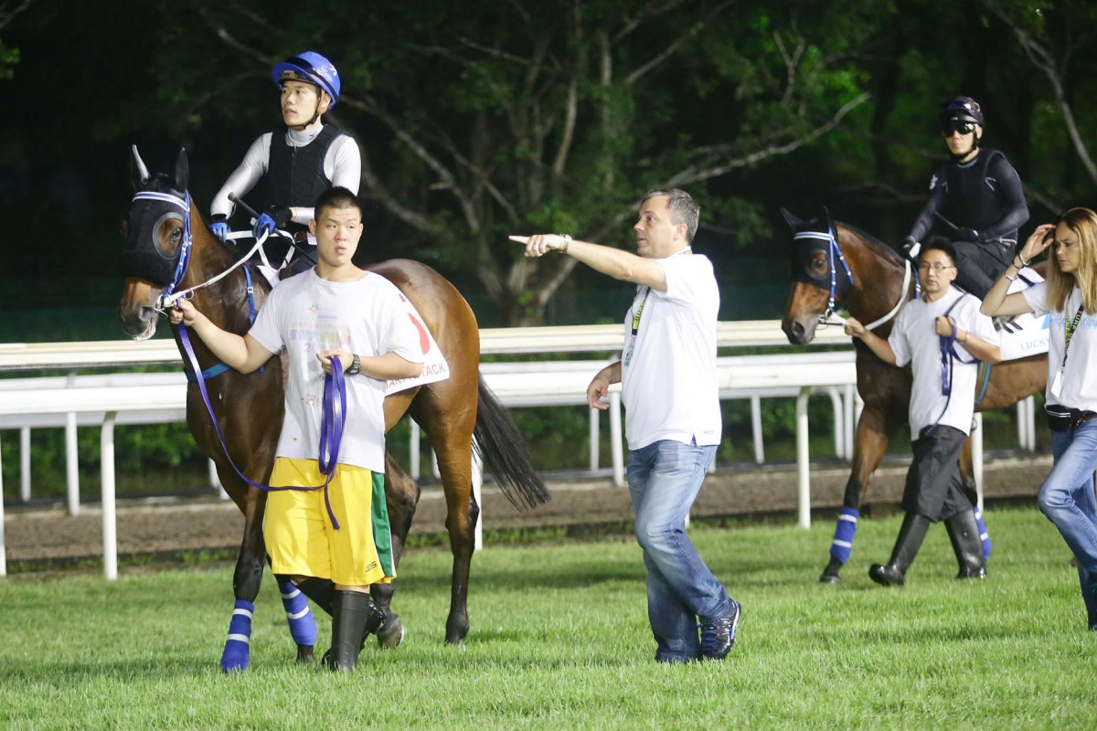 Caspar Fownes briefs his riders at gallops in Singapore. He has been happy with his horses preparation. Photo: Kenneth Chan