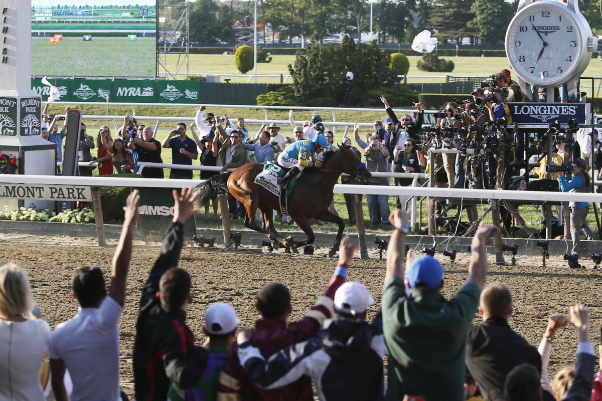 American Pharoah charges to a stunning win at Belmont to secure the Triple Crown. Photo: AP