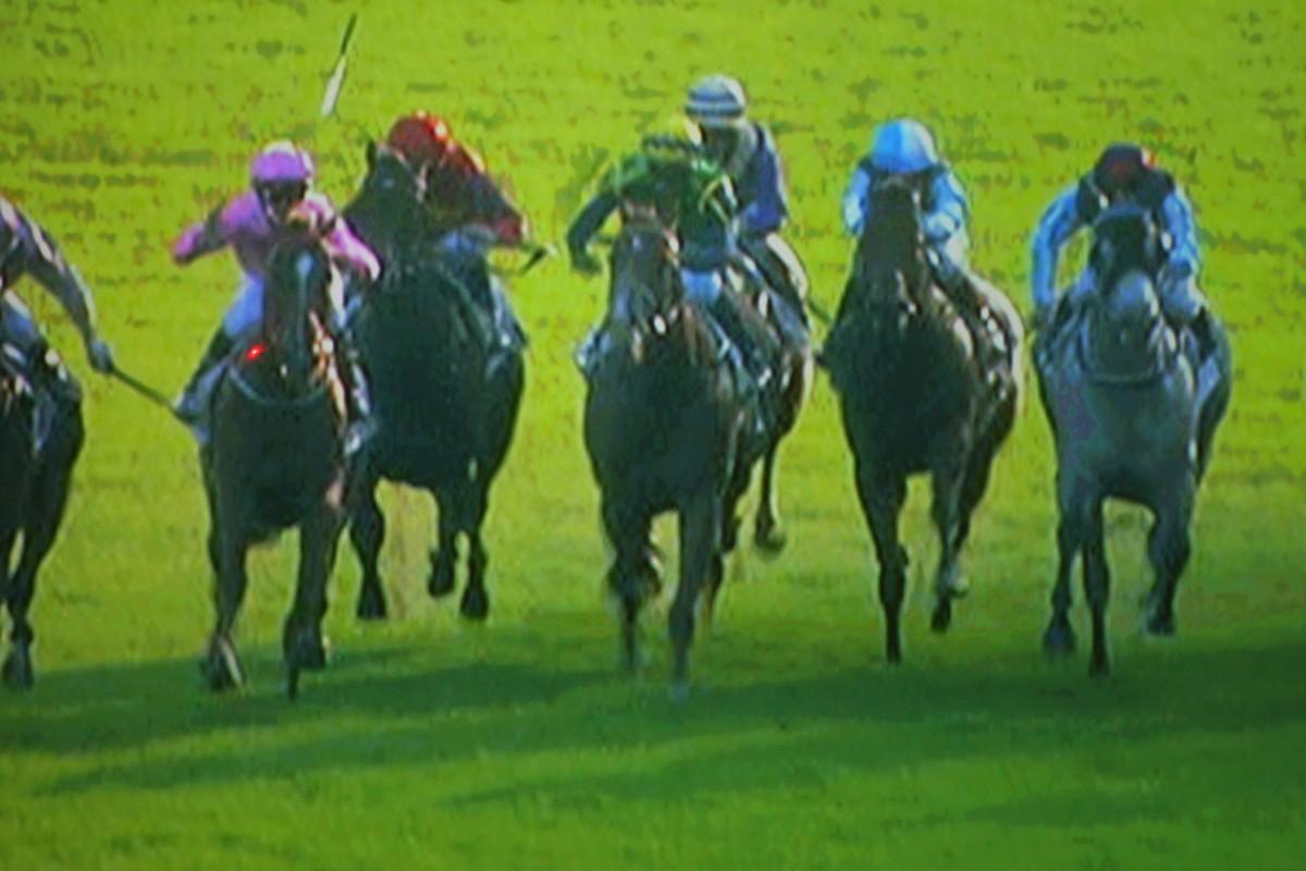 A freeze-frame sequence of Joao Moreira losing his whip from his right hand, before catching it in his left. Click right to view the sequence. Photo: Kenneth Chan