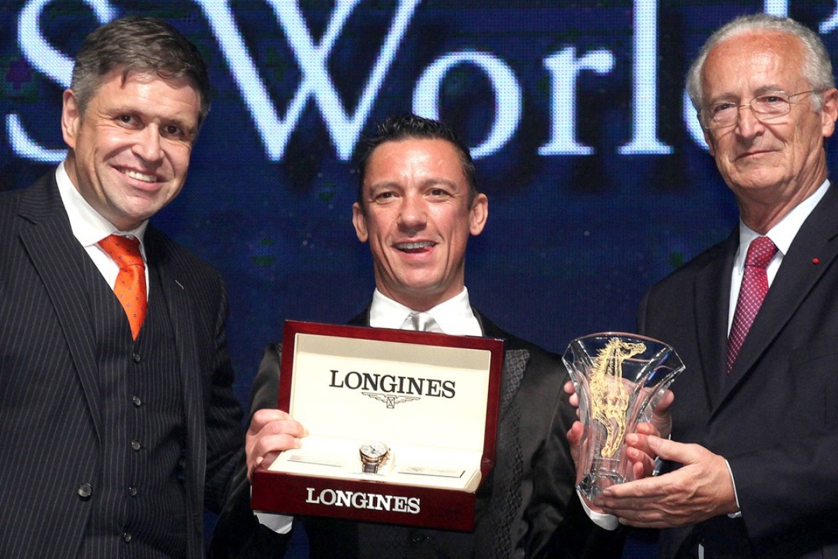 Franki Dettori, flanked by Longines vice-president Juan-Carlos Capelli (left) and Louis Romanet, chairman of the International Federation of Horseracing Authorities, is all smiles after being awarded a trophy and watch in winning the second Longines World Best Jockey title at a ceremony in Hong Kong. Photo: SCMP Pictures