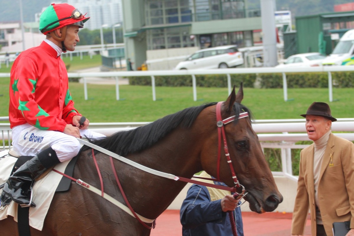 John Moore talks with Corey Brown after Chevalier Star clung on to victory, the first leg of a double for the trainer. Photo: Kenneth Chan