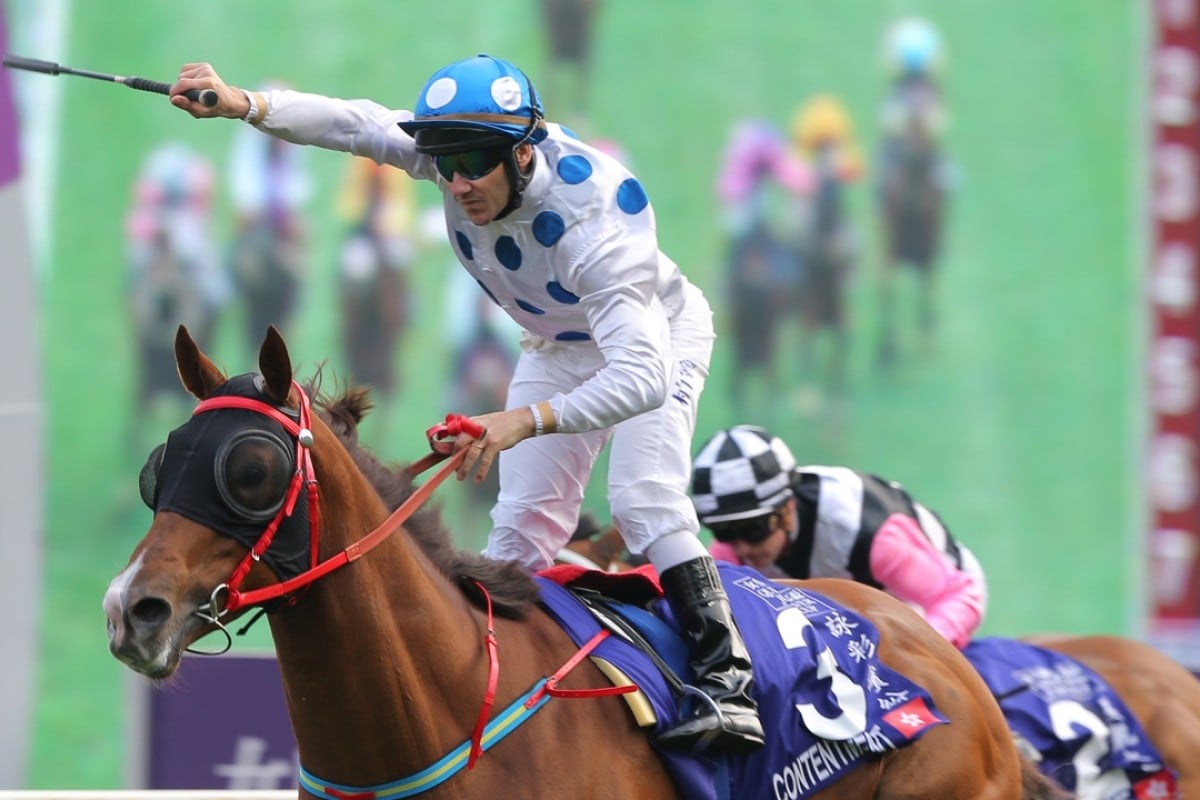 Brett Prebble stands high in the irons to celebrate as Contentment wins his maiden Group One. Photo: Kenneth Chan