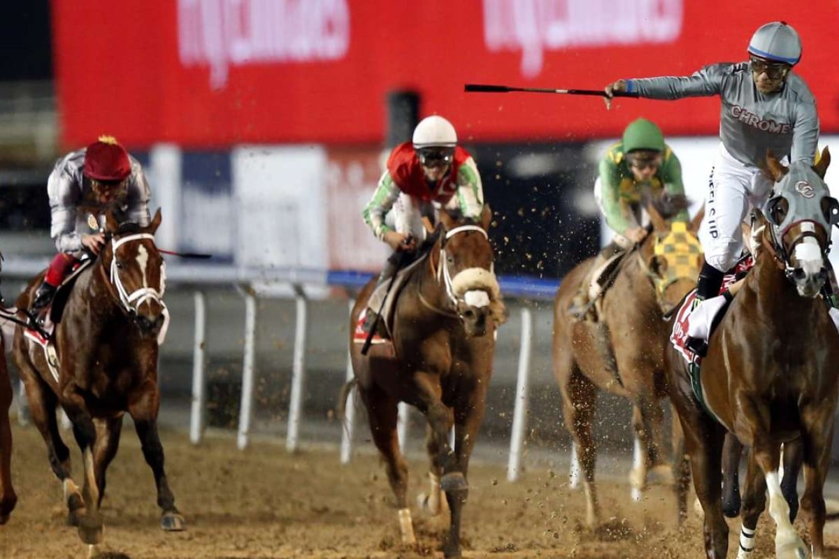 Jockey Victor Espinoza (right), on California Chrome, celebrates after winning the US$10 million Dubai World Cup at the Meydan track last night. Photo: EPA