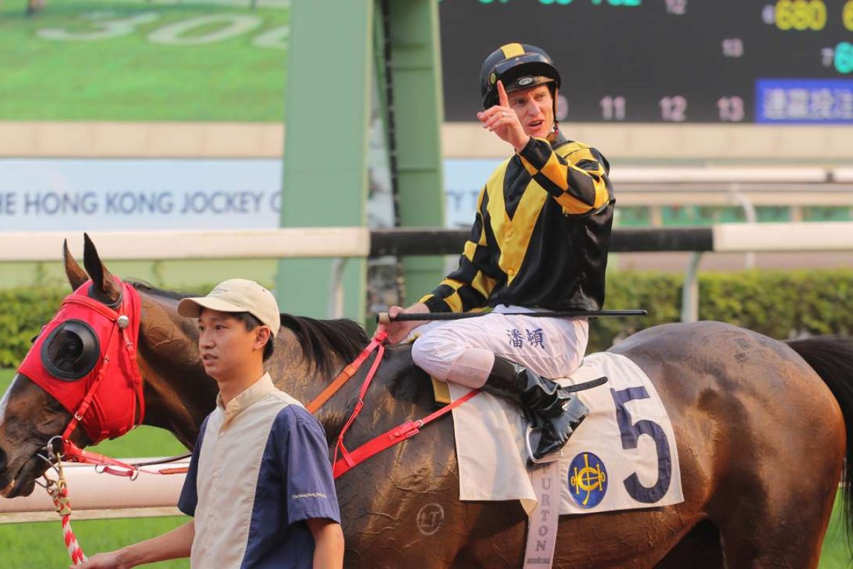 Zac Purton after winning on Rouge Et Blanc. Photos: Kenneth Chan