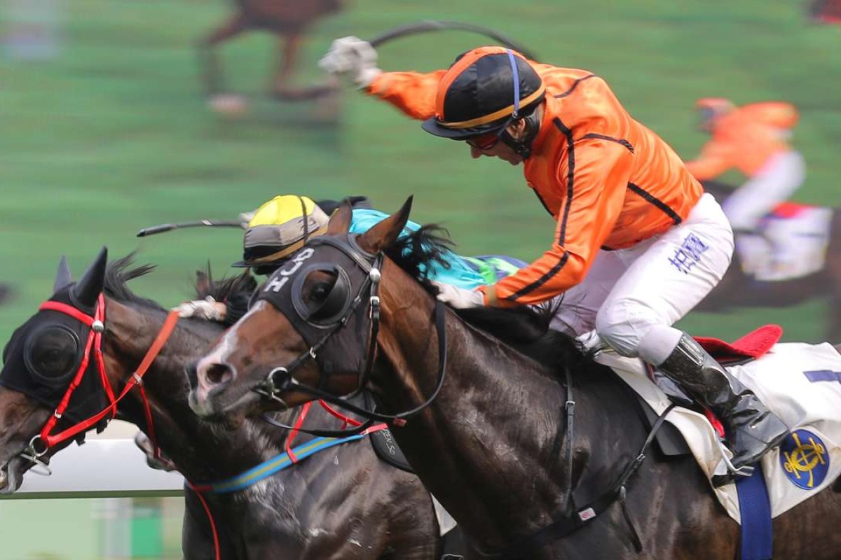 Brett Prebble celebrates exuberantly after getting plenty out of Simply Invincible to score the horse’s first Hong Kong win yesterday. Photo: Kenneth Chan