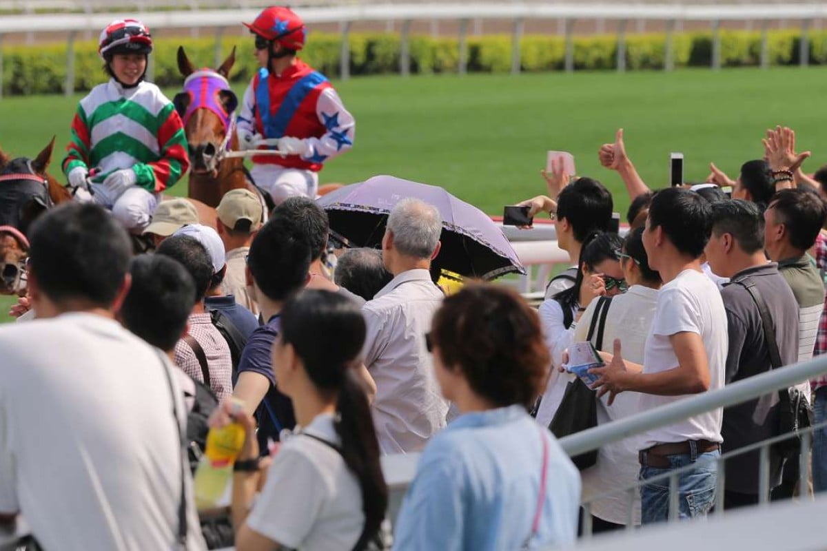 Kei Chiong receives a rapturous reception from the Sha Tin crowd as she returns on Molly’s Jade Star. She is in line to not only win leading local rider, but also most popular jockey. Photo: Kenneth Chan