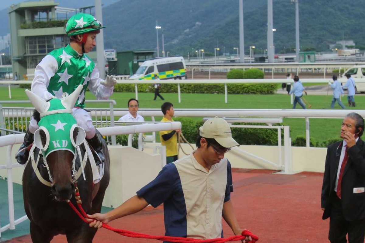 Tony Cruz talks to jockey Matthew Chadwick after Pakistan Star’s stunning win on Sunday. Photos: Kenneth Chan