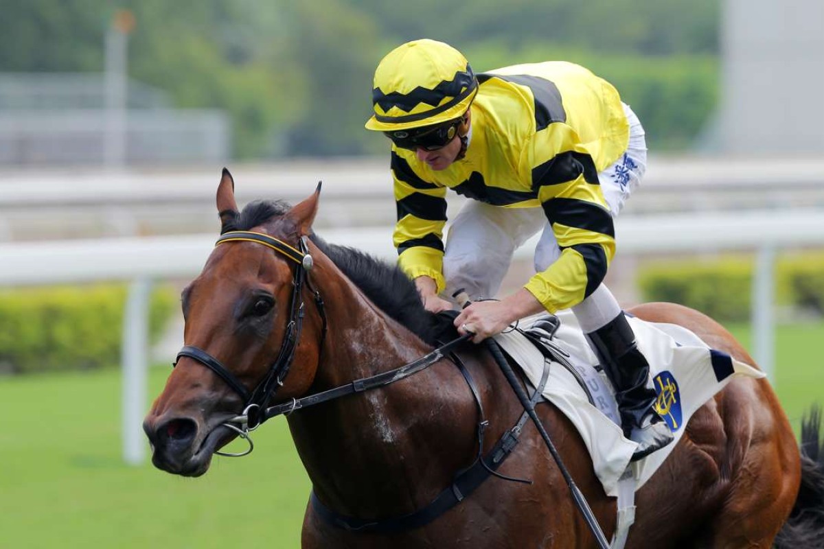 Zac Purton cruises away to salute aboard Dragon Master at Sha Tin last month. Photos: Kenneth Chan