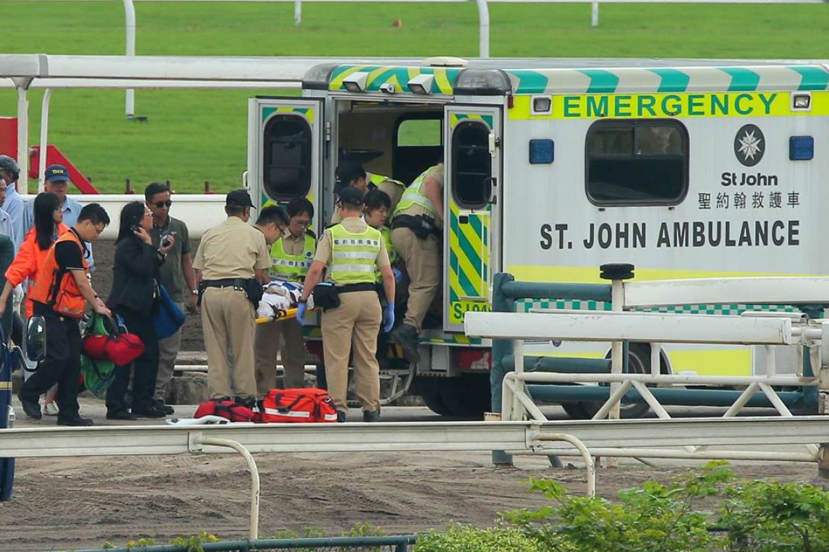 Ben So goes into the ambulance after being knocked unconscious when falling from Silverfield. Photos: Kenneth Chan