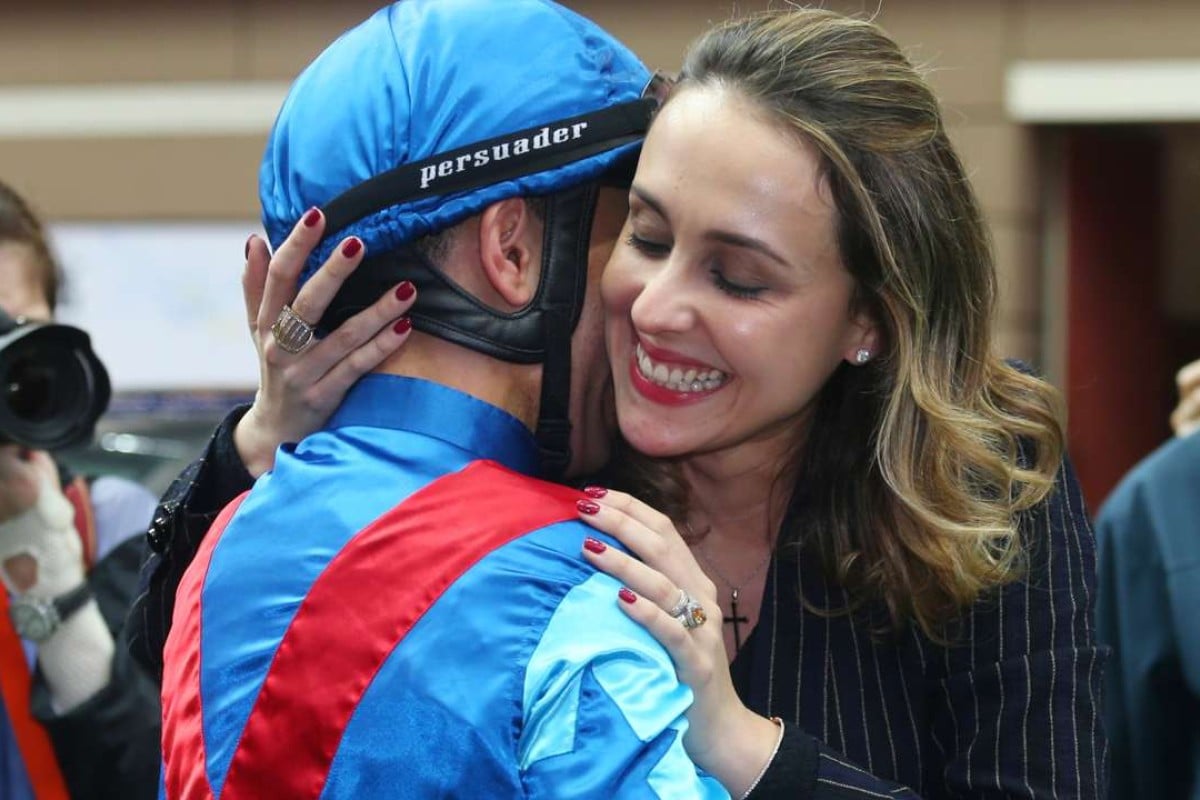 An overwhelmed Joao Moreira gets a big hug from wife Taciana after winning the BMW Derby aboard Rapper Dragon. Photos: Kenneth Chan