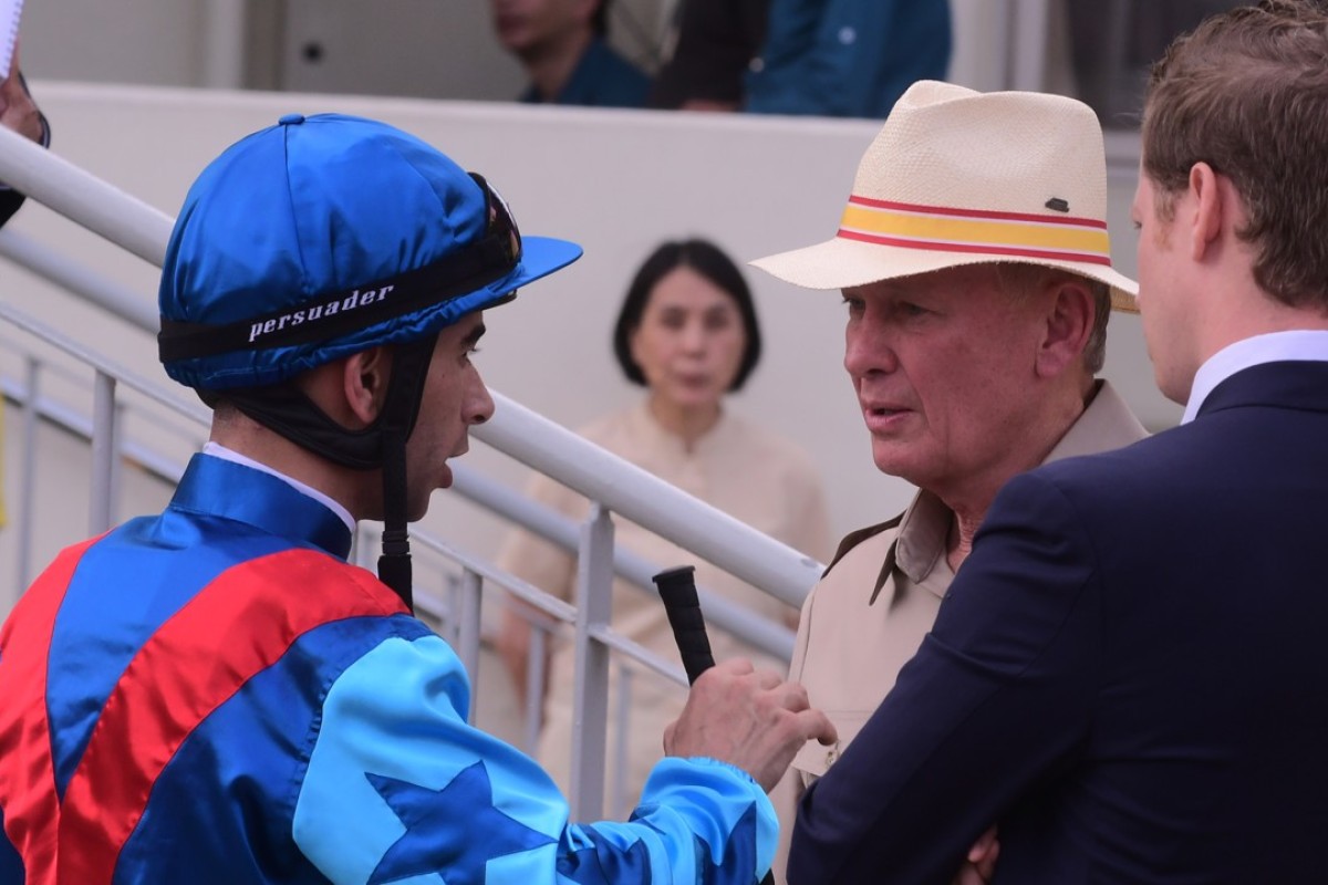 Rapper Dragon jockey Joao Moreira and trainer John Moore after race seven. Photo: Kenneth Chan