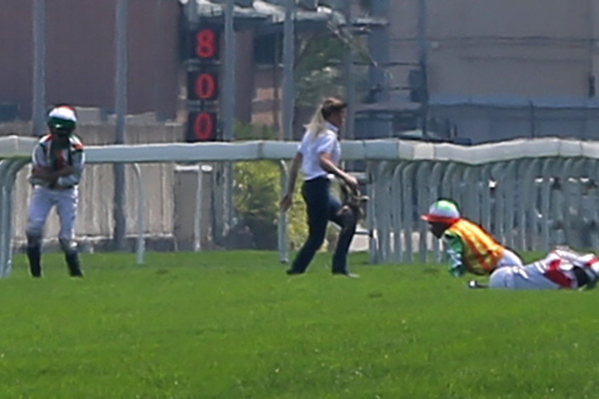 Nash Rawiller (left) holds his shoulder after the incident that brought down three jockeys at Sha Tin in April. Rawiller escaped a suspension after pleading guilty to a careless riding charge but was severely reprimanded. Photos: Kenneth Chan