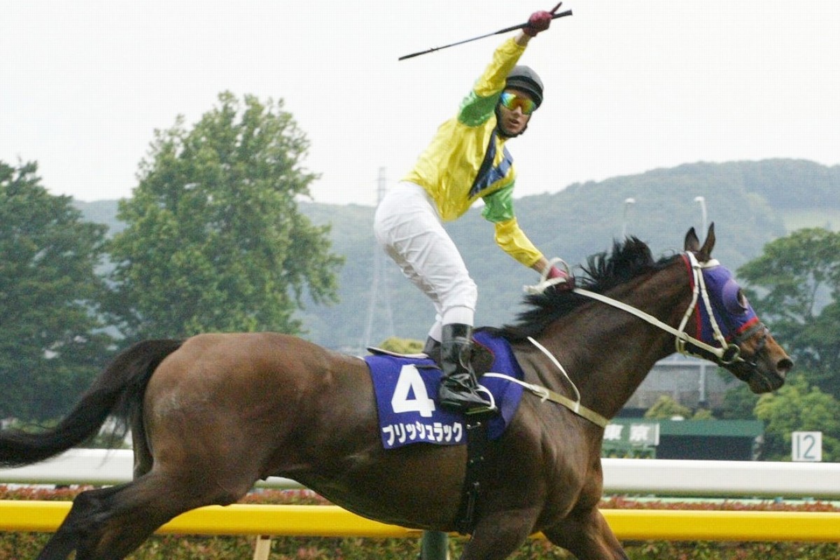 Brett Prebble celebrates aboard Bullish Luck as he wins the 2006 Yasuda Kinen at Tokyo Racecourse. Photo: AP