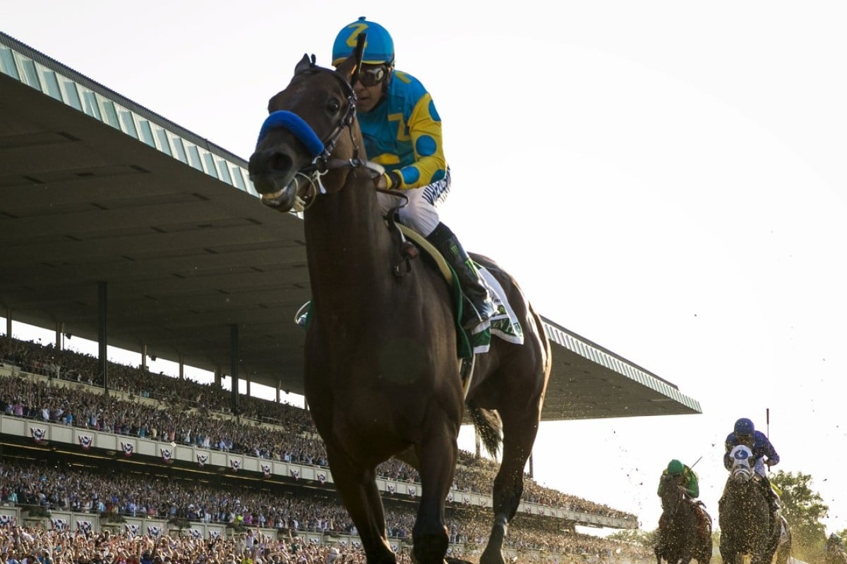American Pharoah wins the 2015 Belmont Stakes to complete the Triple Crown. Photo: REUTERS/Lucas Jackson