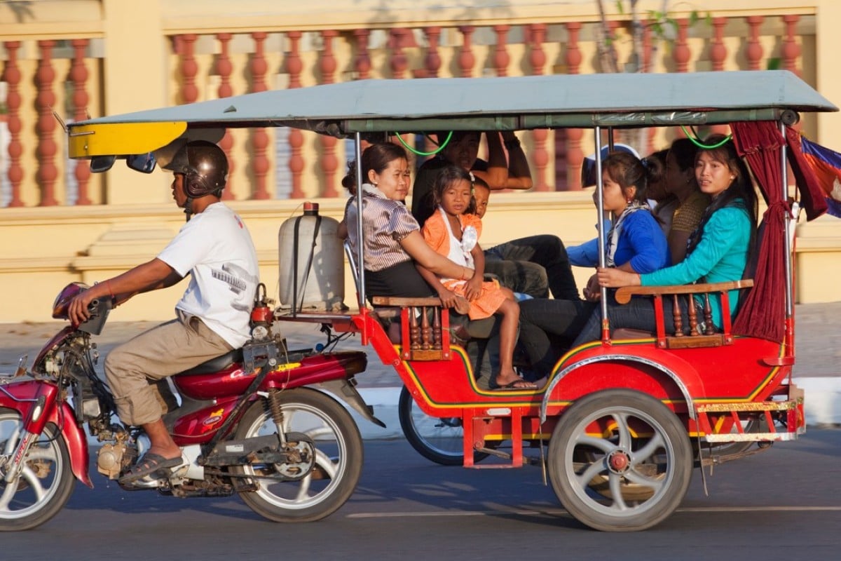 A family travels via tuk-tuk in Phnom Penh, Cambodia | South China Morning Post