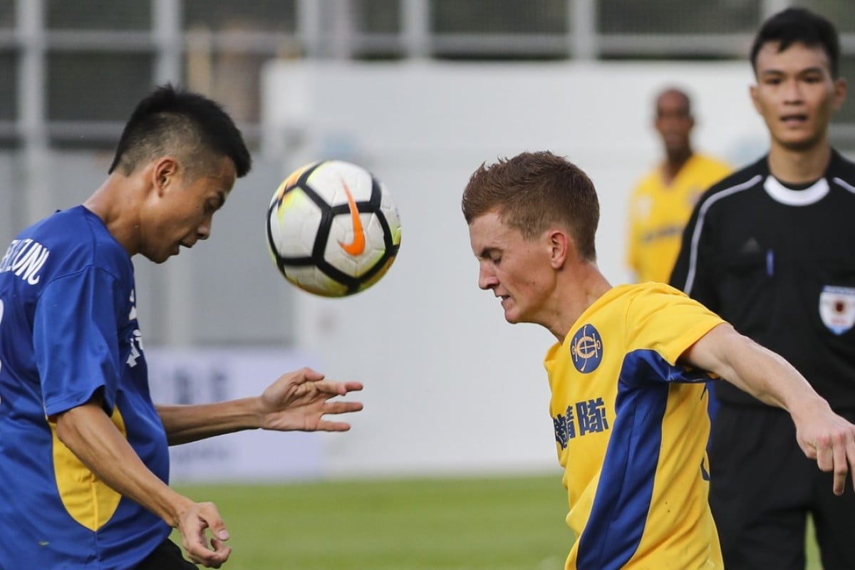 Derek Leung and Chad Schofield compete for the ball at Mong Kong Stadium. Photos: Edward Wong