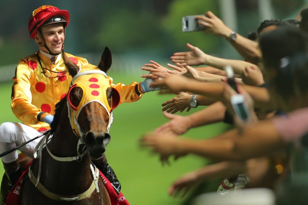 Sam Clipperton celebrates Gold Land’s win with the fans. Photos: Kenneth Chan