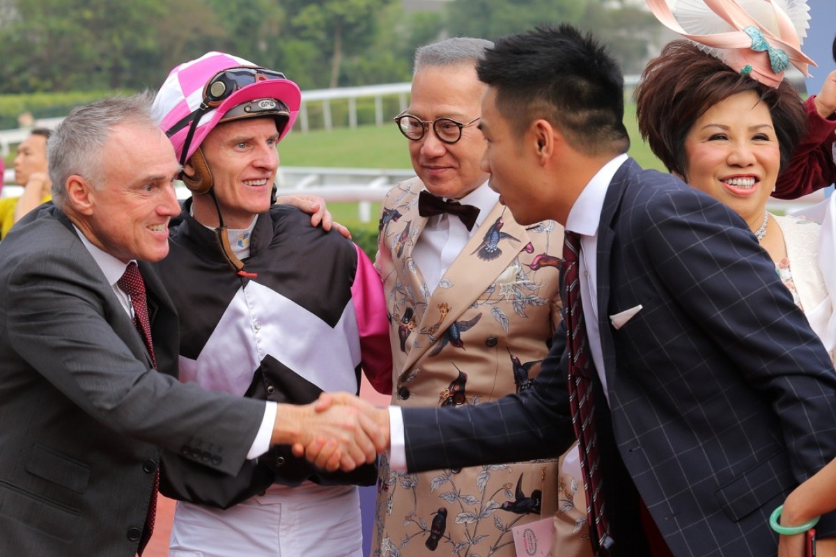 Paul O’Sullivan and Zac Purton celebrate Win Beauty Win’s victory with connections. Photos: Kenneth Chan
