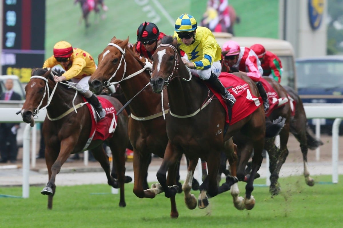 Tommy Berry pushes out Werther to collect the Group Two Jockey Club Cup at Sha Tin on Sunday. Photos: Kenneth Chan