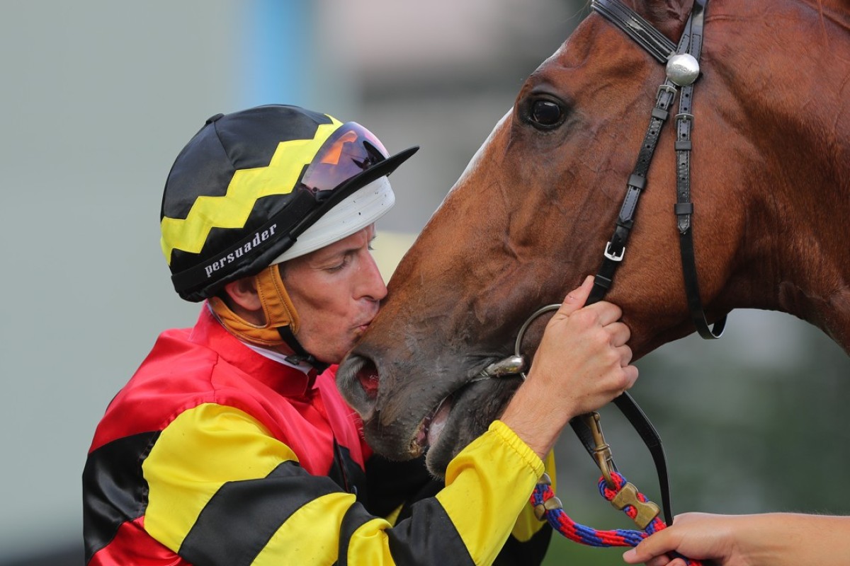 Hugh Bowman gives Lucky Bubbles a kiss after winning the Group One Chairman’s Sprint Prize. Photos: Kenneth Chan
