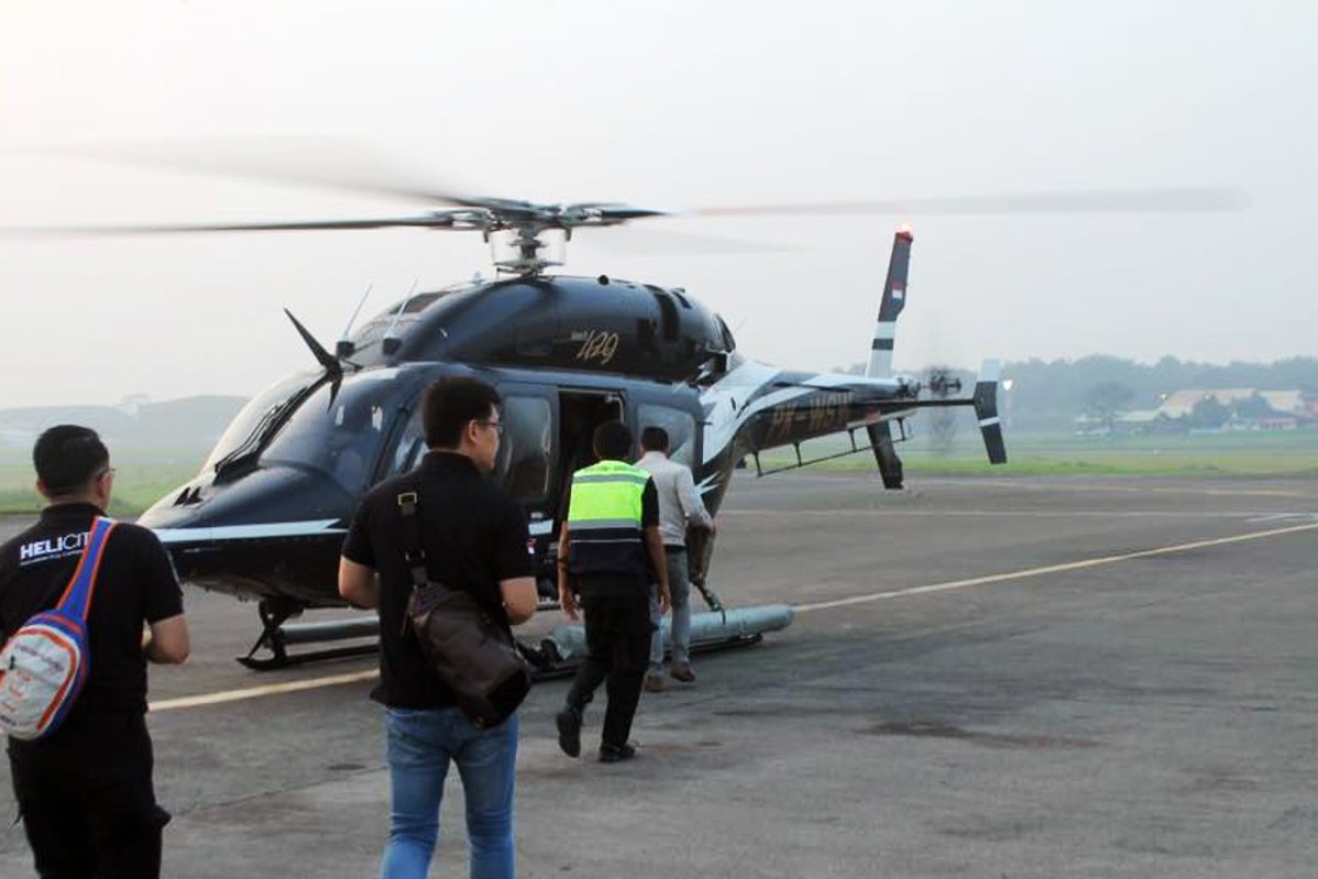 A Helicity helicopter loads passengers in Indonesia. Whitesky Aviation recently began commuter service after a year-long trial. Photo: Facebook