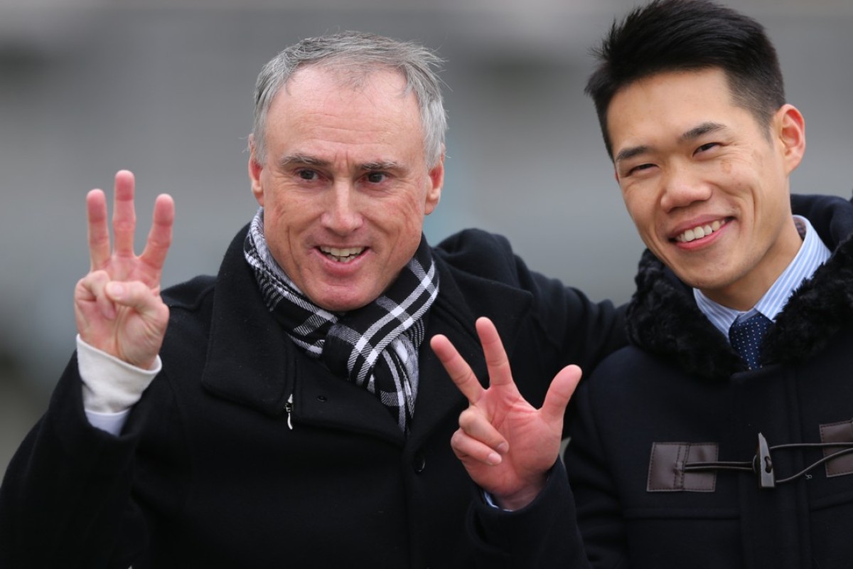 Paul O’Sullivan celebrates a treble with his assistant trainer. Photos: Kenneth Chan