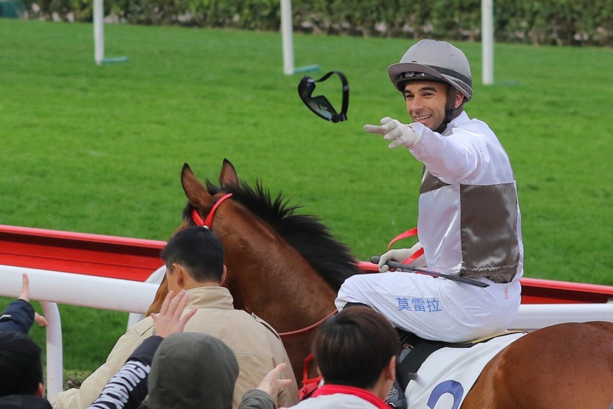 Joao Moreira throws his goggles into the crowd after winning on Ivictory on February 4 at Sha Tin. Photos: Kenneth Chan.