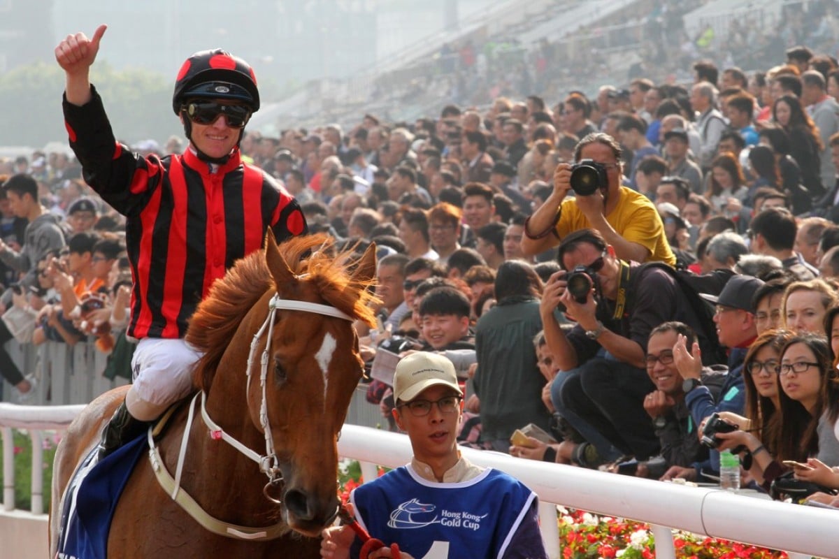 Zac Purton celebrates taking out the CITI Hong Kong Gold Cup on Time Warp. Photos: Kenneth Chan