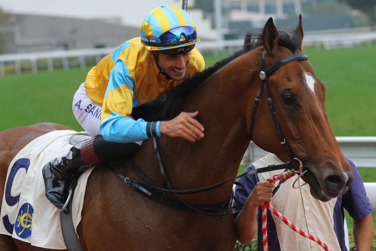 Alberto Sanna gives Mr Lumieres a pat after winning on debut. Photos: Kenneth Chan