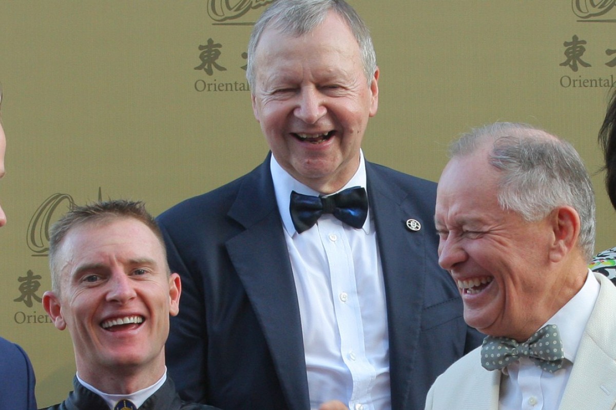 Zac Purton (left) and John Moore (right) share a laugh with Jockey Club chief executive Winfried Engelbrecht-Bresges (middle). Photo: Kenneth Chan