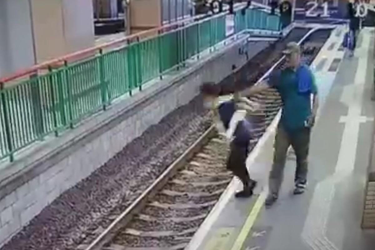 Facebook capture of cleaner Liang Youdi being pushed on to the tracks by Jamshed Qazi near Yuen Long Light Railway station on October 21, 2017.