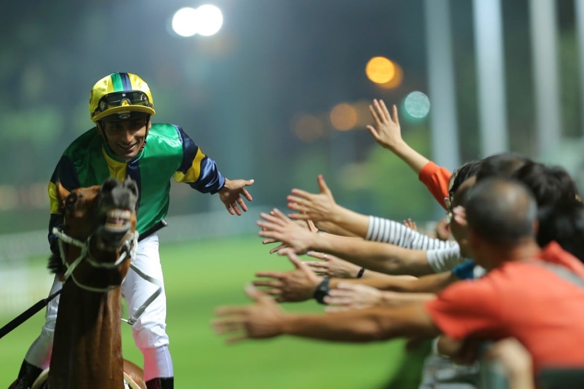 Karis Teetan high fives fans after a win at Happy Valley on Wednesday night. Photos: Kenneth Chan