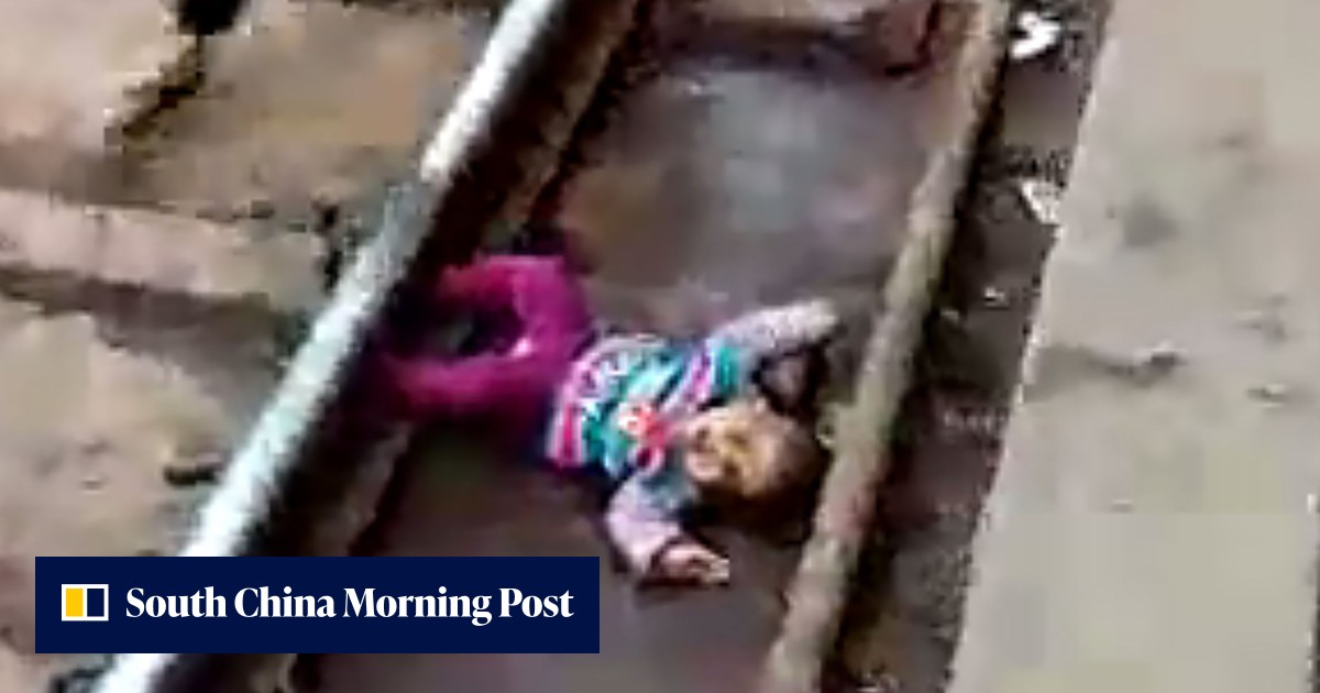 Baby girl dropped onto railway tracks in India survives being run over ...